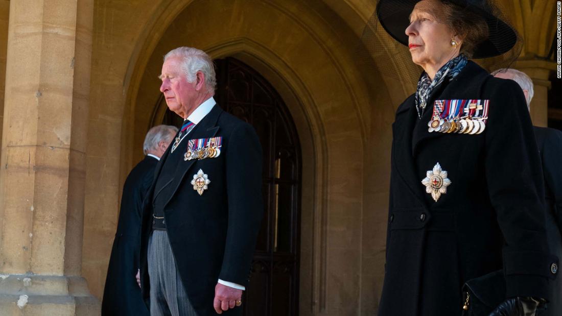 Prince Charles and Princess Anne prepare for the funeral procession to begin.