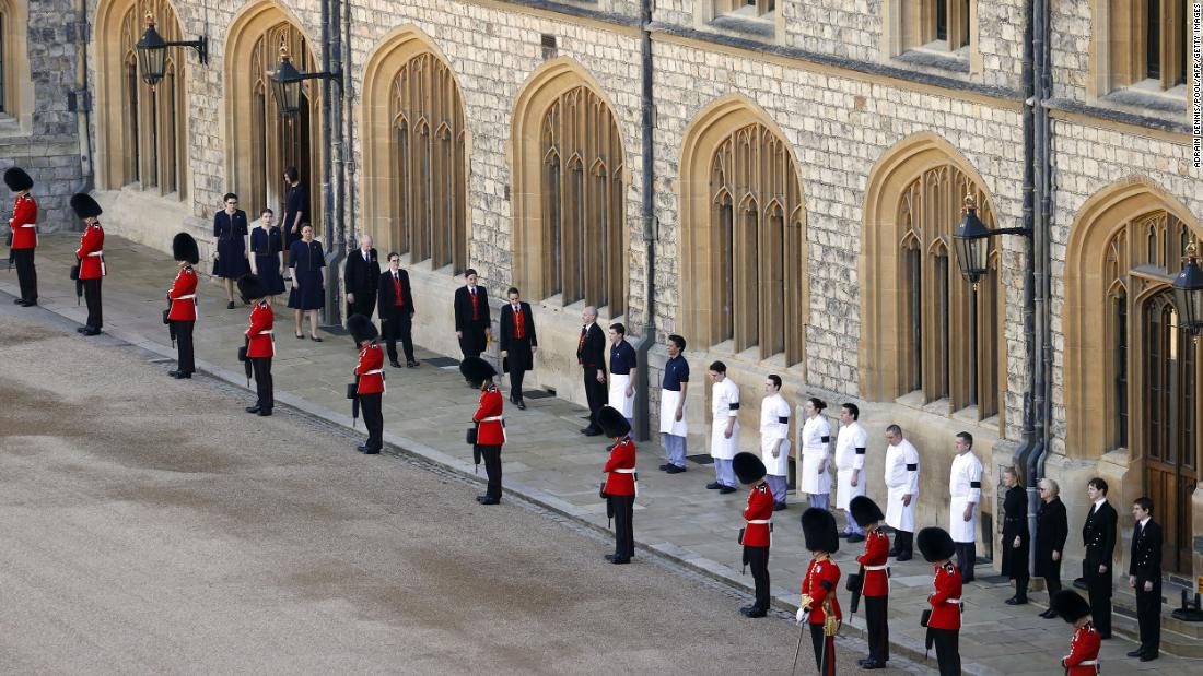 Guardsmen and royal household staff take part in the ceremony.