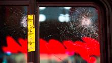 EDITORS NOTE: Graphic content / Damaged glass and adhesive measuring tape is pictured on a bus window at the scene of a shooting that left one person dead and seven injured, including a child, in downtown Seattle, Washington on January 22, 2020. - At least one person was killed and seven others, including a child, were wounded on Wednesday after gunfire broke out in downtown Seattle near a popular tourist area, police and hospital officials said. Police said at least one suspect was being sought in connection with the mass shooting that took place near a McDonald&#39;s fast food restaurant, just blocks away from the Pike Place Market. (Photo by Jason Redmond / AFP) (Photo by JASON REDMOND/AFP via Getty Images)