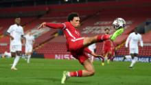 LIVERPOOL, ENGLAND - APRIL 14:  Trent Alexander-Arnold of Liverpool controls the ball during the UEFA Champions League Quarter Final Second Leg match between Liverpool FC and Real Madrid at Anfield on April 14, 2021 in Liverpool, England. Sporting stadiums around the UK remain under strict restrictions due to the Coronavirus Pandemic as Government social distancing laws prohibit fans inside venues resulting in games being played behind closed doors.  (Photo by Shaun Botterill/Getty Images)