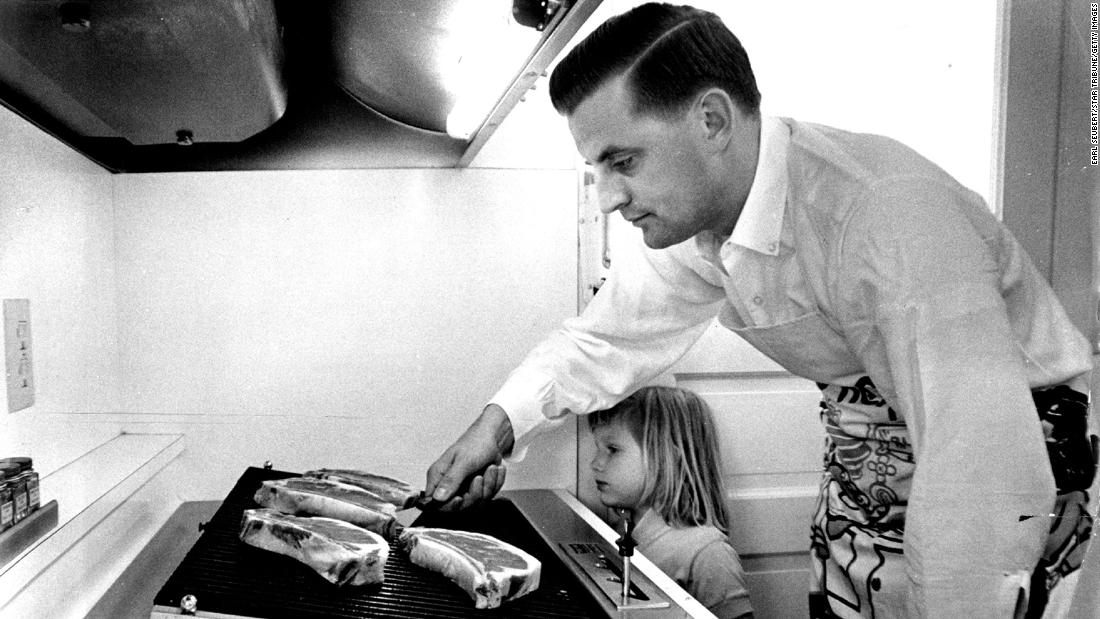 Mondale and his 4-year-old daughter Eleanor cook steaks in his family&#39;s new kitchen in Minneapolis on June 20, 1964.