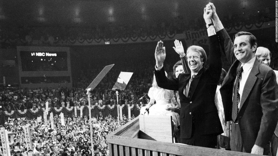 Jimmy Carter and Mondale clasp hands after their acceptance speeches for the Democratic presidential ticket at the Democratic National Convention at Madison Square Garden in Manhattan on July 15, 1976.