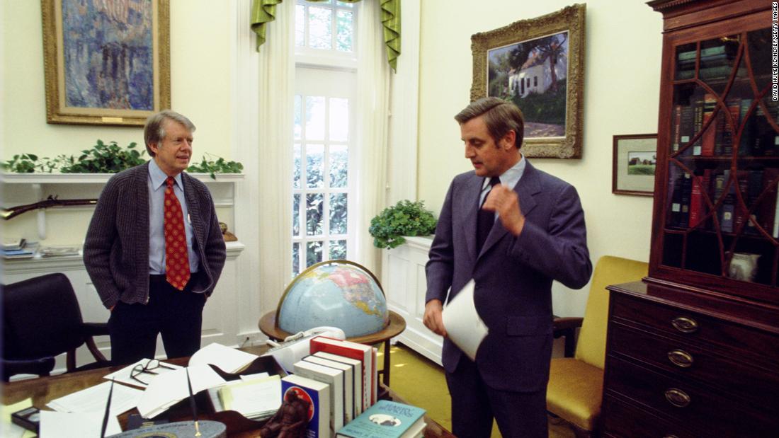 President Carter speaks with Vice President Mondale in the Oval Office in Washington, DC, in May 1977. They defeated the Republican ticket, Gerald Ford and Bob Dole, in the 1976 election.  