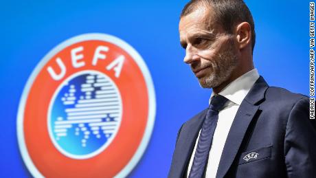 UEFA president Aleksander Ceferin walks past a sign with the UEFA logo after attending a press conference following a meeting of the executive committee at the UEFA headquarters, in Nyon, Switzerland on December 4, 2019. (Photo by Fabrice COFFRINI / AFP) (Photo by FABRICE COFFRINI/AFP via Getty Images)
