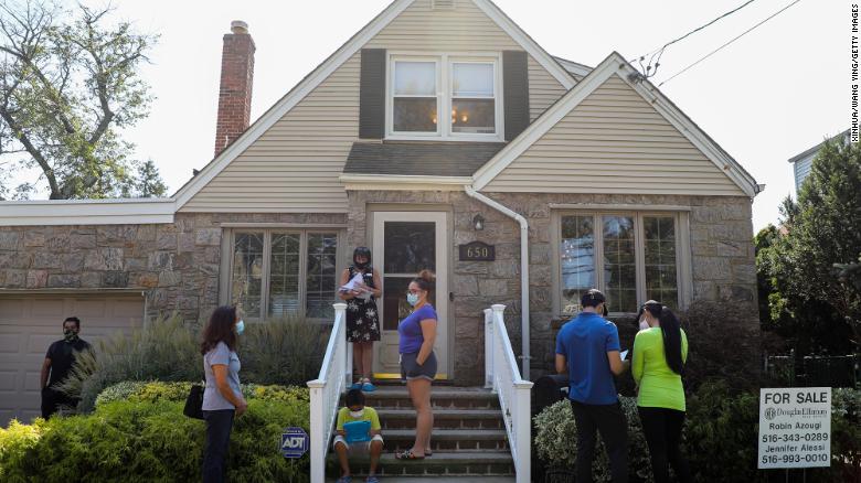 People wait to visit a house for sale in Floral Park, New York, on Sept. 6, 2020.