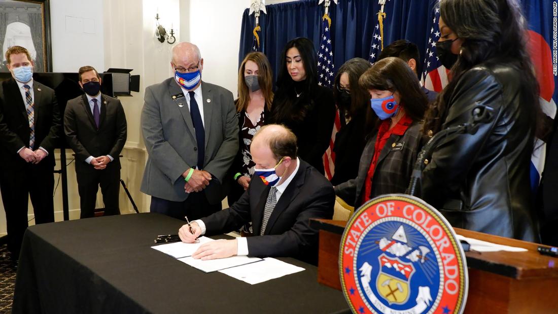 Colorado governor Jared Polis signs two weapons measures nearly a month after the Boulder shooting