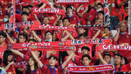 Fans cheer during the Guangzhou derby, the opening match of the new Chinese Super League season, on April 20 in Guangzhou, China. 