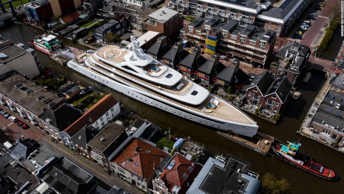 Huge superyacht squeezes down narrow Dutch canals