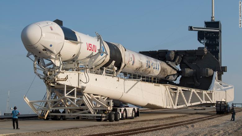 A SpaceX Falcon 9 rocket with the company&#39;s Crew Dragon spacecraft is rolled to Launch Complex 39A as preparations continue for the Crew-2 mission at NASA&#39;s Kennedy Space Center.