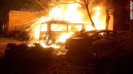 Smoke blows from a burning vehicles at the site of bomb blast in Quetta, Pakistan, on April 21, 2021.