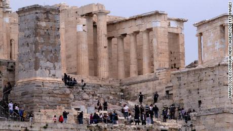 People visit the Acropolis in Athens, Greece, on April 18. Archaeological sites were opened to the public for the International Day for Monuments and Sites.