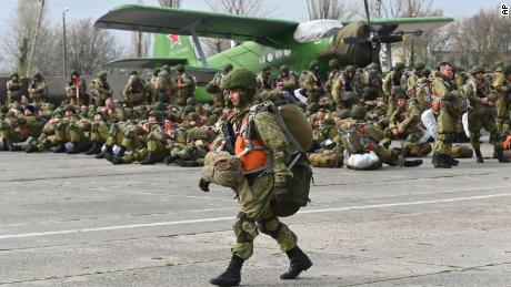 Russia pulls back troops after massive buildup near Ukraine border