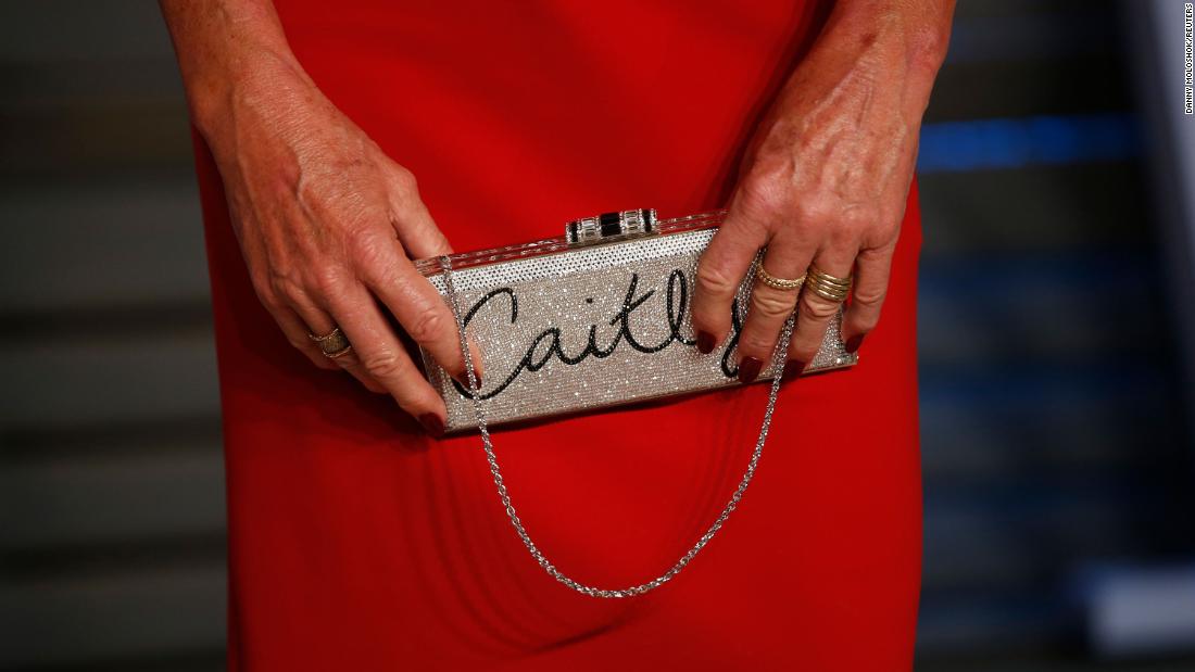 Jenner holds her clutch purse on the red carpet of the 2018 Vanity Fair Oscar party.