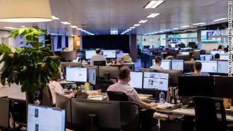 Employees work in the newsroom of the South China Morning Post (SCMP) in Hong Kong, on June 5, 2020. 