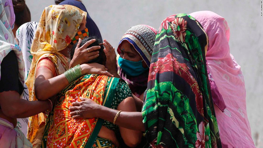 Relatives of a Covid-19 victim mourn for their loved one outside a government hospital in Ahmedabad on April 17.