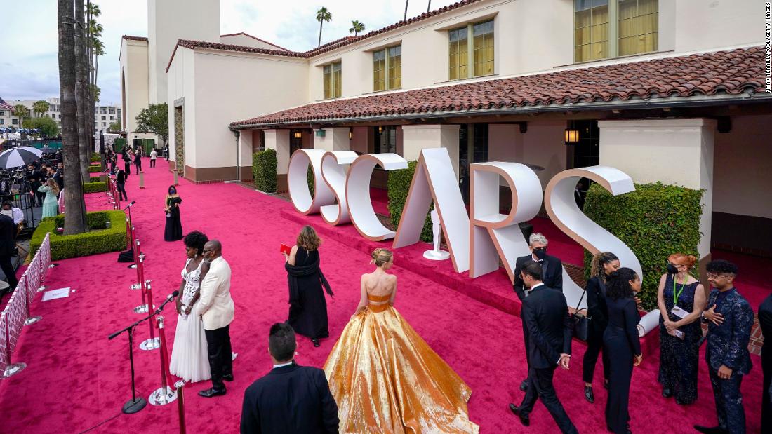 Best actress nominee Viola Davis and her husband, Julius Tennon, are seen on the left after arriving on the red carpet.