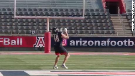 Arizona football alum Gronkowski sets a world record by catching a pass dropped from a helicopter 600 feet in the air. 
