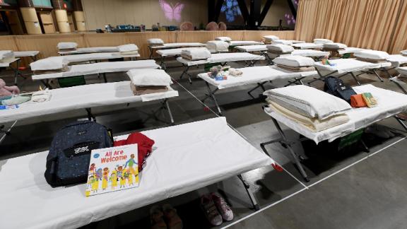 Sleeping quarters set up inside Exhibit Hall B for migrant children are shown during a tour of the Long Beach Convention Center on April 22, 2021 in in Long Beach, California. Long Beach officials and officials with the U.S. Department of Health and Human Services led the tour. Migrant children found at the border without a parent were scheduled to be temporarily housed at the facility beginning today. Officials say the center can accommodate up to 1,000 children. 