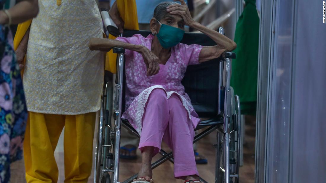 A woman waits to receive a Covid-19 vaccine in Mumbai on April 18.