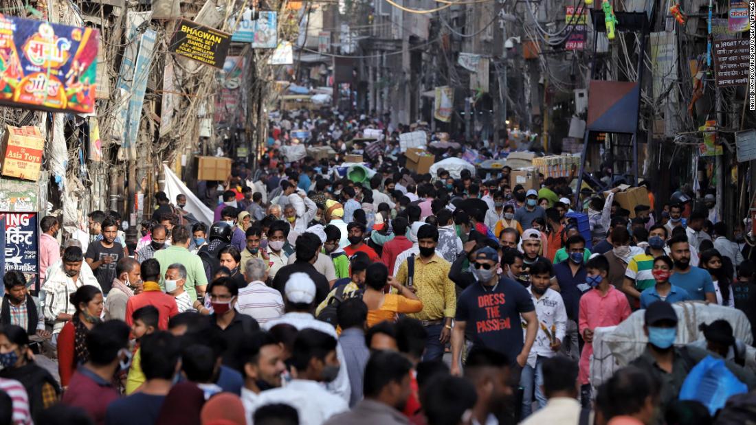 Social distancing was not easy to achieve as people walked through a busy market in Old Delhi on March 27.