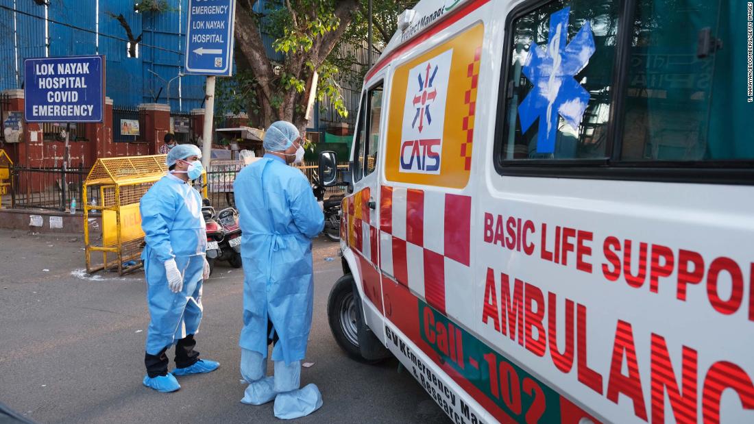 Health workers turn away an ambulance at the main entrance of the Lok Nayayak Jaiprakash Hospital in New Delhi on April 25.