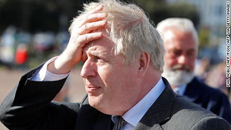 Britain&#39;s Prime Minister Boris Johnson gestures as he campaigns in Llandudno, north Wales on April 26, 2021