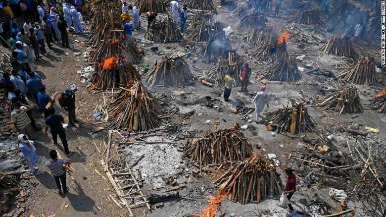 Multiple funeral pyres burn in New Delhi on Tuesday, April 27.