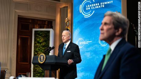 President Joe Biden, left, delivering remarks alongside Special Presidential Envoy for Climate John Kerry on the second day of the virtual climate summit on April 23. 