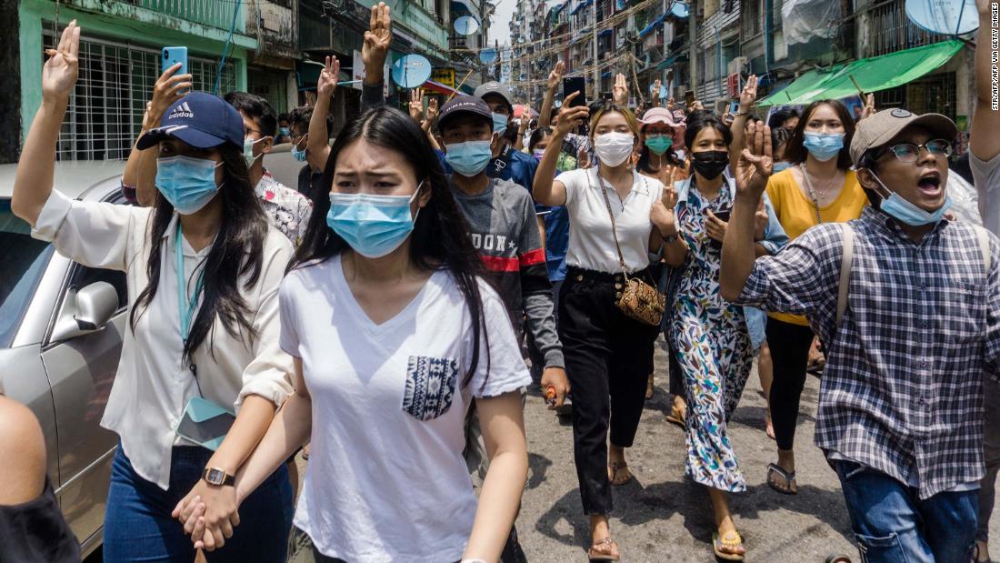 Protesters make the three-finger salute of resistance during an anti-coup demonstration in Yangon, Myanmar, on Tuesday, April 27.