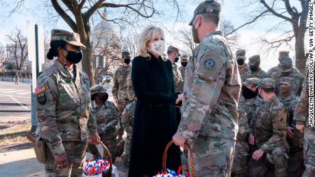 Biden greets members of the National Guard with chocolate chip cookies outside the US Capitol in January. 