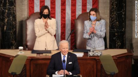 WASHINGTON, DC - APRIL 28: U.S. President Joe Biden addresses a joint session of congress as Vice President Kamala Harris (L) and Speaker of the House U.S. Rep. Nancy Pelosi (D-CA) (R) look on in the House chamber of the U.S. Capitol April 28, 2021 in Washington, DC. On the eve of his 100th day in office, Biden spoke about his plan to revive America&#39;s economy and health as it continues to recover from a devastating pandemic. He delivered his speech before 200 invited lawmakers and other government officials instead of the normal 1600 guests because of the ongoing COVID-19 pandemic. (Photo by Chip Somodevilla/Getty Images)