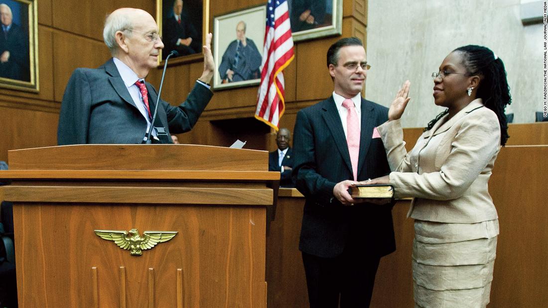 Supreme Court justice Stephen Breyer, left, administers the oath of office to US District Court judge Jackson in May 2013. Jackson&#39;s husband, Patrick Jackson, is holding the Bible.