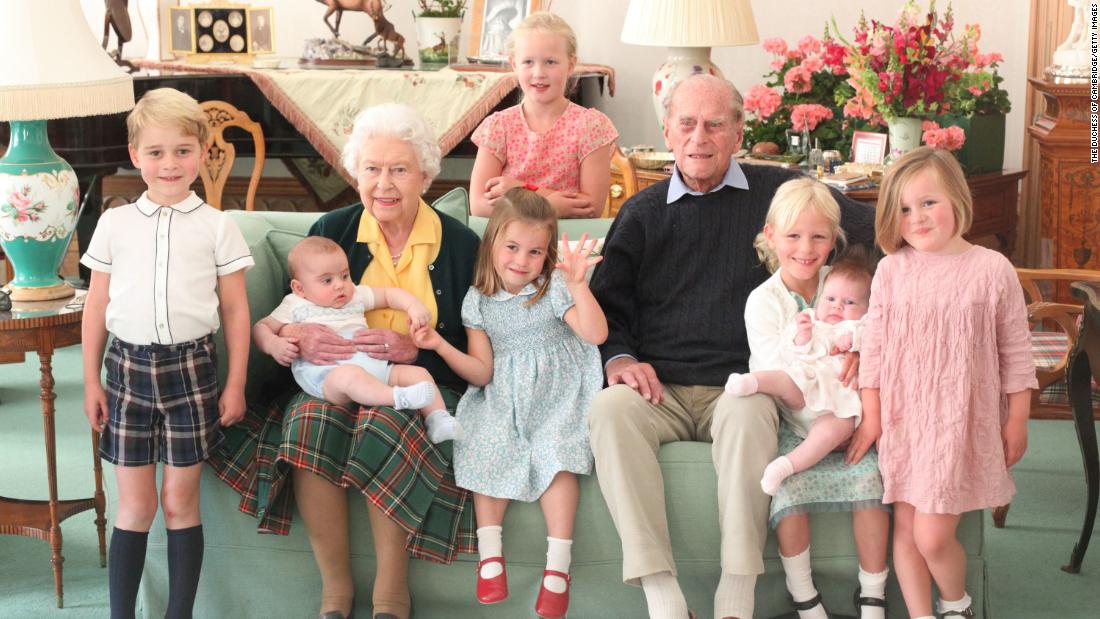 Queen Elizabeth II and Prince Philip pose with seven of their great-grandchildren in this photo taken in 2018. The children, from left, are Prince George, Prince Louis, Princess Charlotte, Savannah Phillips, Isla Phillips, Lena Tindall and Mia Tindall.