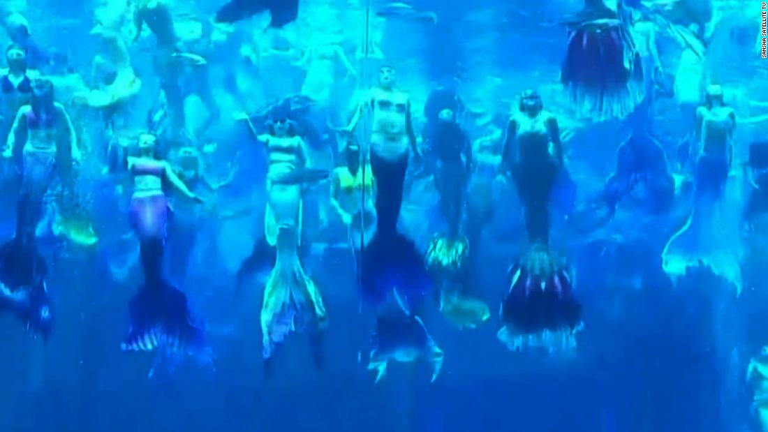 See 100 mermaids in a world record performance – CNN Video