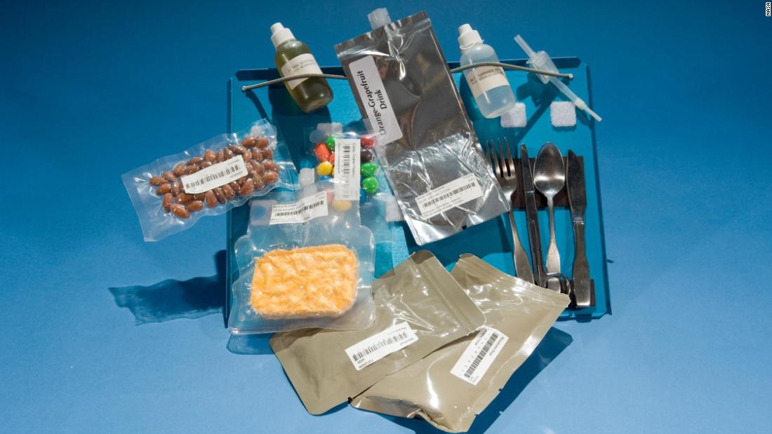 Shown are rehydratables from the &#39;80s Space Shuttle missions and the first appearance of M&amp;amp;Ms on the space food menu. Referred to simply as &quot;candy-coated chocolates&quot; by NASA, they are now a regular space snack. Note the magnets securing the cutlery to the tray. 