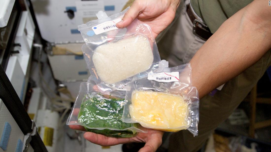 A sampling of processed space food is shown in orbit.