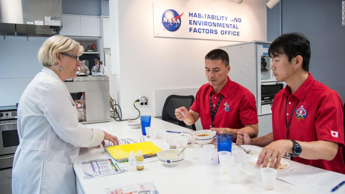 NASA astronaut Kjell Lindgren (center) and Japan Aerospace Exploration Agency astronaut Kimiya Yui (right), both Expedition 44/45 flight engineers, participate in a food tasting at NASA&#39;s Johnson Space Center in Houston, July 10, 2014.