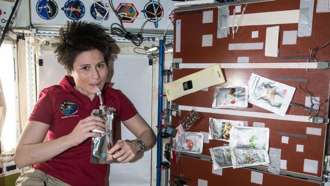 European Space Agency astronaut Samantha Cristoforetti is seen taking a drink in the Unity module aboard the International Space Station, April 27, 2015. The crew&#39;s food galley is located in Unity; several food packets are visible to the right.