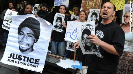 Aidge Patterson of the LA Coalition for Justice for Oscar Grant leads a protest rally in 2010. (MARK RALSTON/AFP via Getty Images)