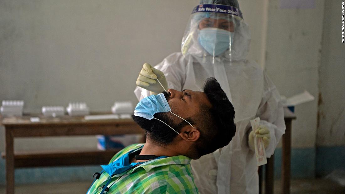 A health worker administers a Covid-19 test in Siliguri on April 30.