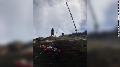 The City of San Diego Fire-Rescue Department posted the following photos of their rescue operation and wreckage after a boat officials believe was used for human smuggling struck a reef.