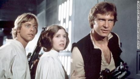 Binge-watching films set in a galaxy far, far away May 4 makes for great pandemic escapism. (From left) Mark Hamill, the late Carrie Fisher and Harrison Ford are shown in &quot;Star Wars: Episode IV - A New Hope.&quot;