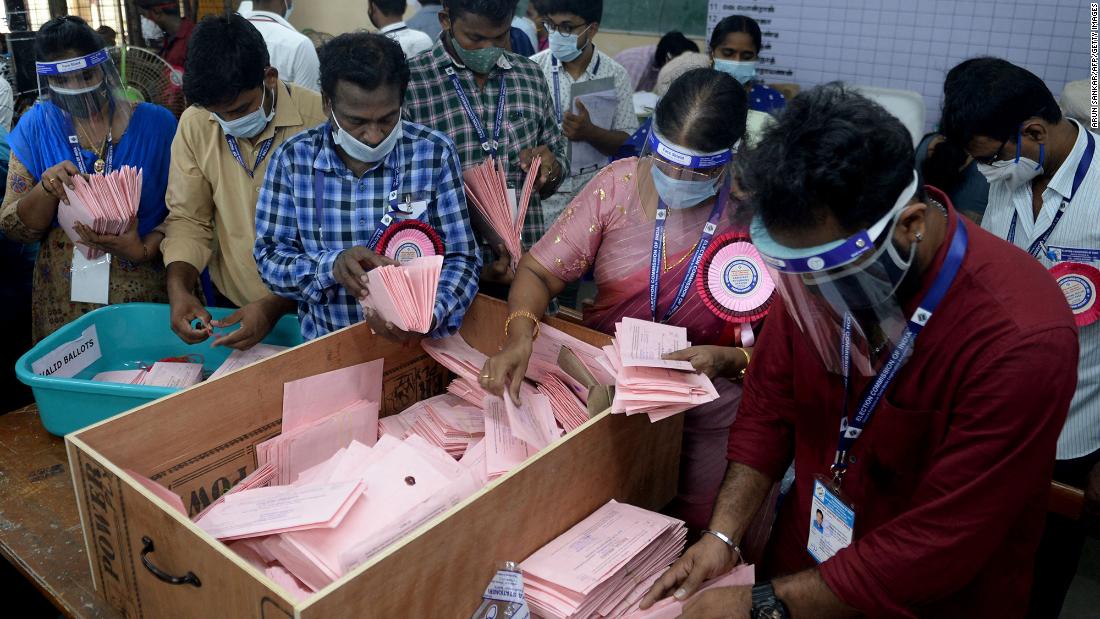 Officials in Chennai prepare to open postal ballots for state elections, which have taken place during this second wave of Covid-19.