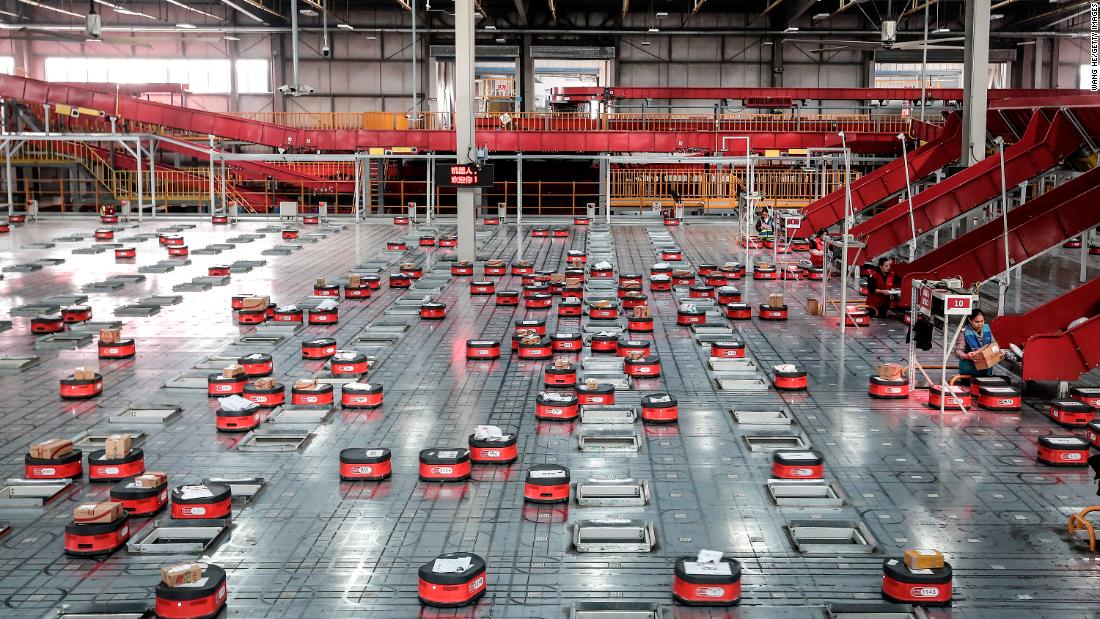 Robots sort packages at a warehouse run by JD.com -- one of China&#39;s largest e-commerce firms, in Wuhan, China, ahead of the annual Singles Day online shopping bonanza, in 2019.