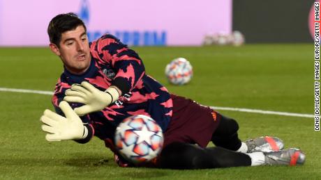 MADRID, SPAIN - DECEMBER 09: Thibaut Courtois of Real Madrid warms up prior to the UEFA Champions League Group B stage match between Real Madrid and Borussia Moenchengladbach at Estadio Alfredo di Stefano on December 09, 2020 in Madrid, Spain. Sporting stadiums around Spain remain under strict restrictions due to the Coronavirus Pandemic as Government social distancing laws prohibit fans inside venues resulting in games being played behind closed doors. (Photo by Denis Doyle/Getty Images)