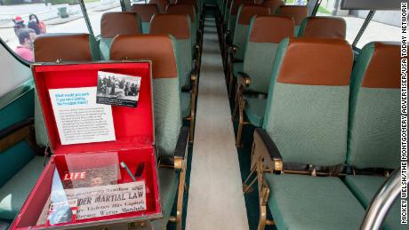 A vintage suitcase with artifacts from the Freedom Riders sits aboard the restored Greyhound bus.