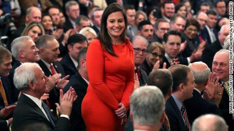 Rep. Elise Stefanik (R-NY) (C) stands as she&#39;s acknowledged by U.S. President Donald Trump as he speaks one day after the U.S. Senate acquitted on two articles of impeachment, in the East Room of the White House February 6, 2020 in Washington, DC. 