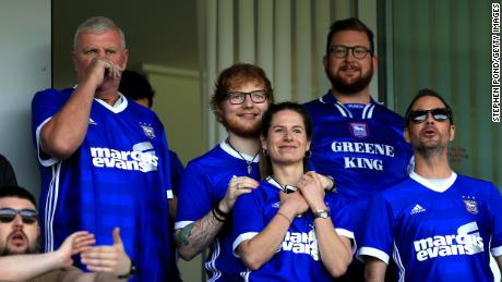 Ed Sheeran and fiance Cherry Seaborn look on during a Championship match between Ipswich Town and Aston Villa at Portman Road on April 21, 2018.