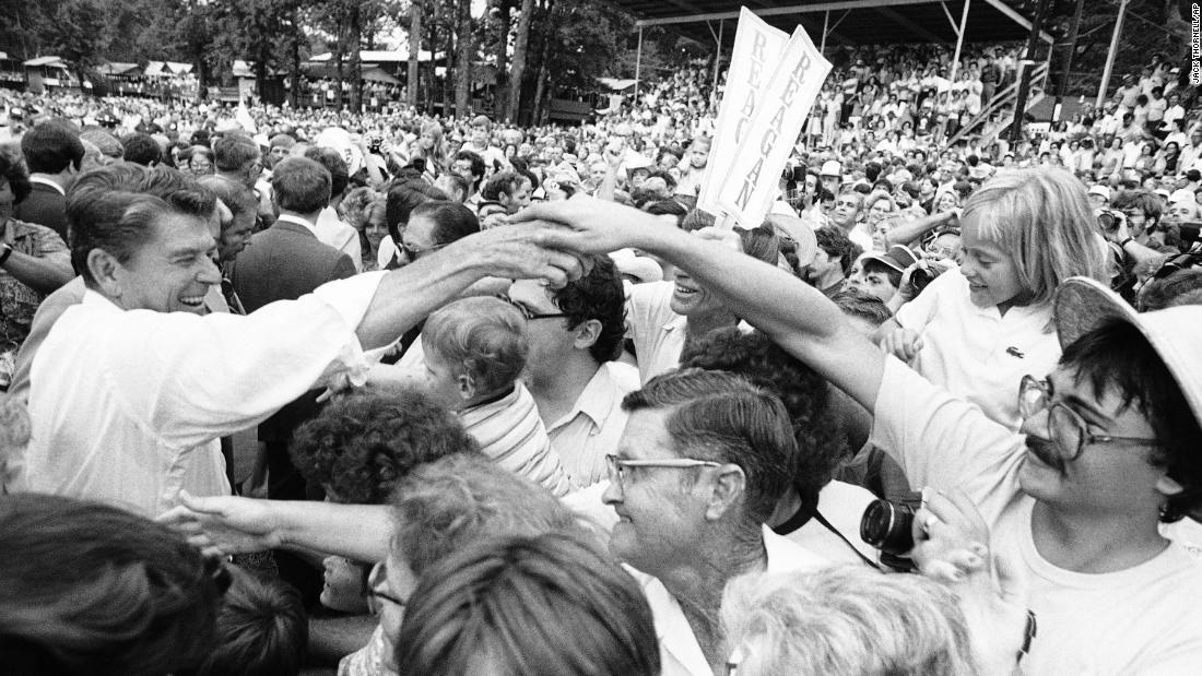 Republican presidential candidate Ronald Reagan moves through a crowd shaking hands at the Neshoba County Fair in Philadelphia, Mississippi on Sunday, August 3, 1980. The &quot;Welfare Queen&quot; story was part of Reagan&#39;s campaign speeches four years earlier.
