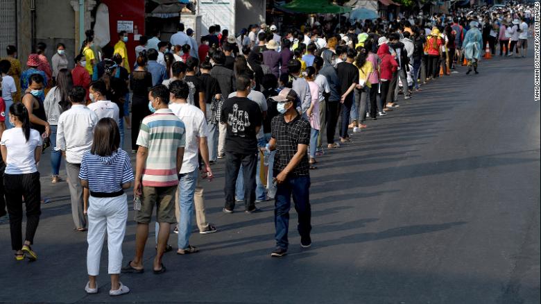 People line up to receive a dose of China's Sinopharm Covid-19 coronavirus vaccine at a school in Phnom Penh on May 3.